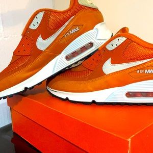 Orange and white Nike Airmax.